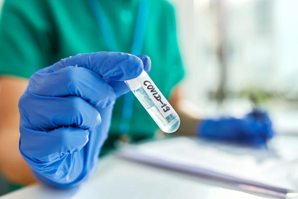 Close-up of epidemiologist working on coronavirus research in a laboratory.